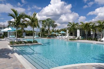 Resort-inspired heated pool with waterfall, lap lane, cabanas & heated spa
